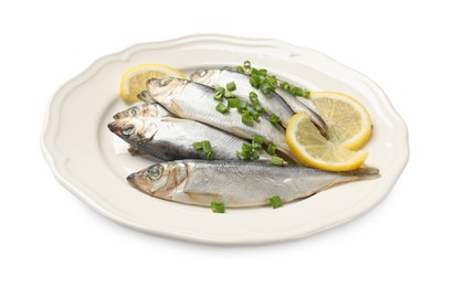 Photo of Fresh raw sprats, green onion and cut lemon isolated on white