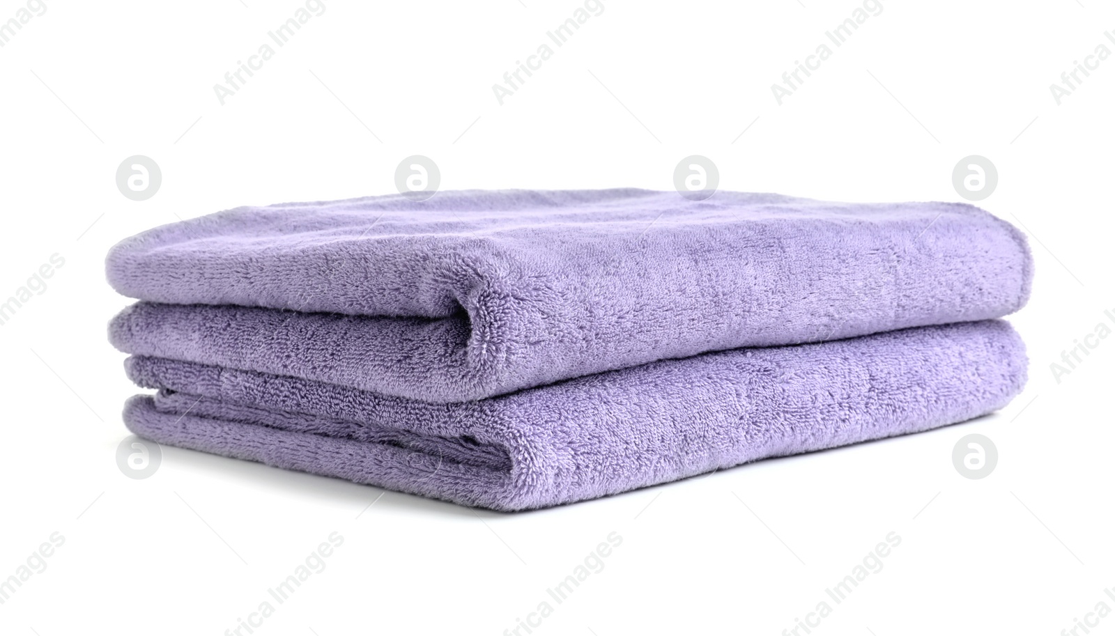 Photo of Folded clean soft towels on white background