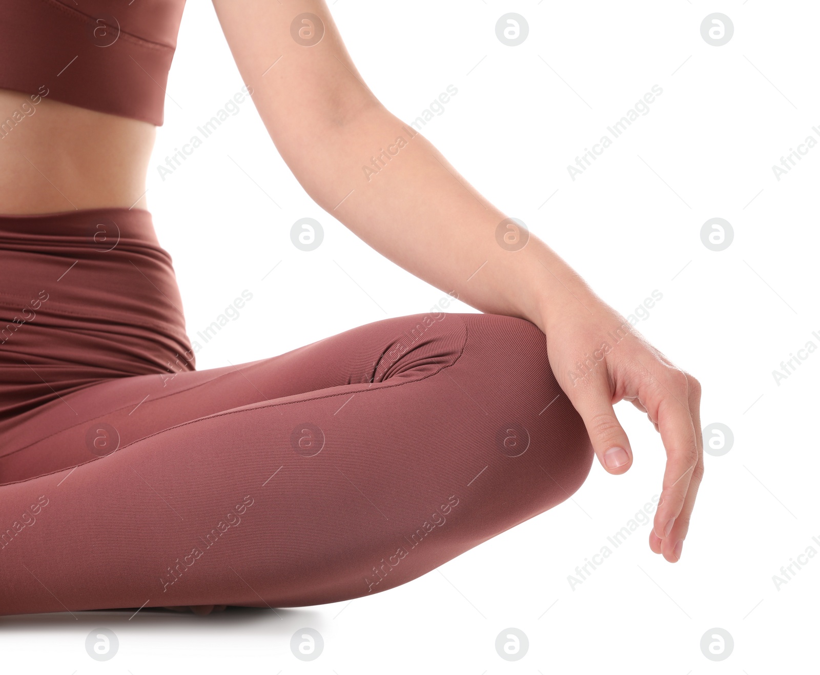 Photo of Woman in sportswear meditating on white background, closeup