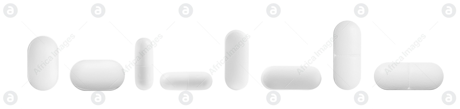 Image of Set of different pills in row isolated on white