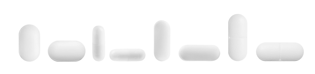 Image of Set of different pills in row isolated on white