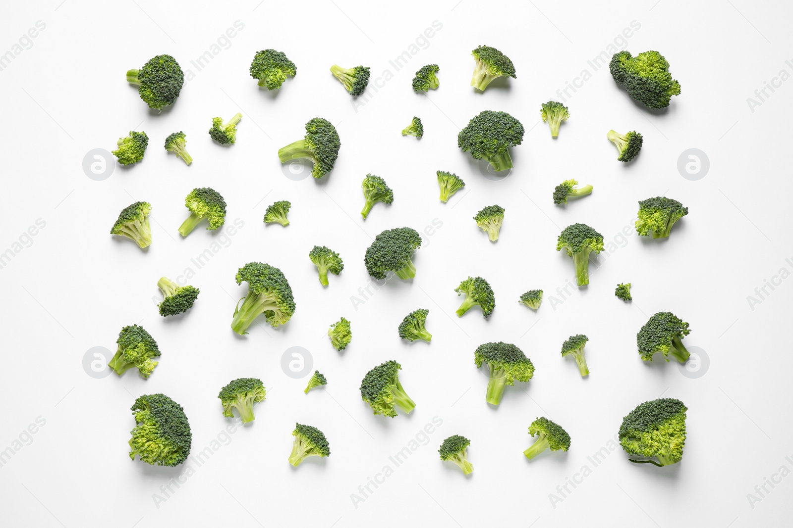 Photo of Fresh tasty broccoli on white background, top view