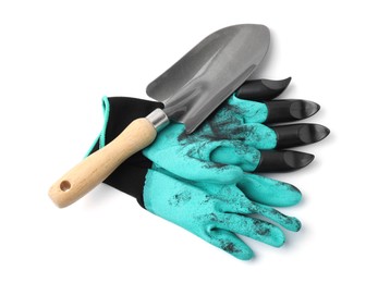 Photo of Pair of claw gardening gloves and trowel isolated on white, top view