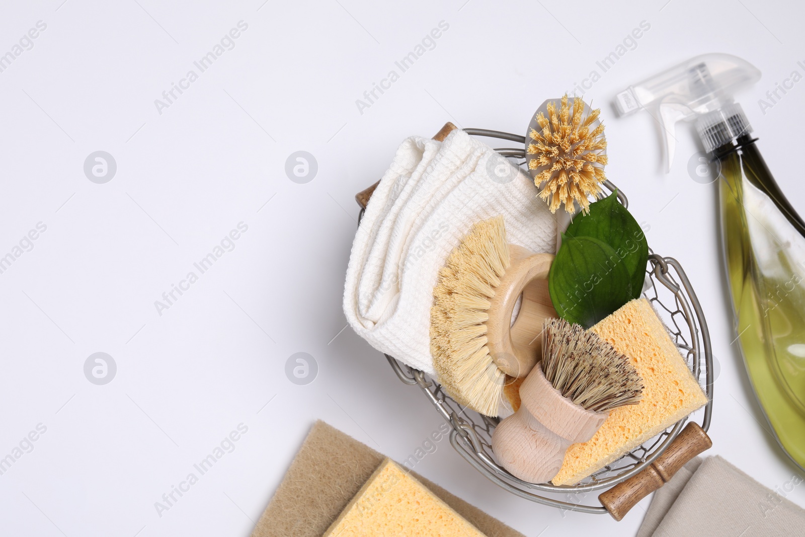 Photo of Flat lay composition with different cleaning supplies on white background, space for text