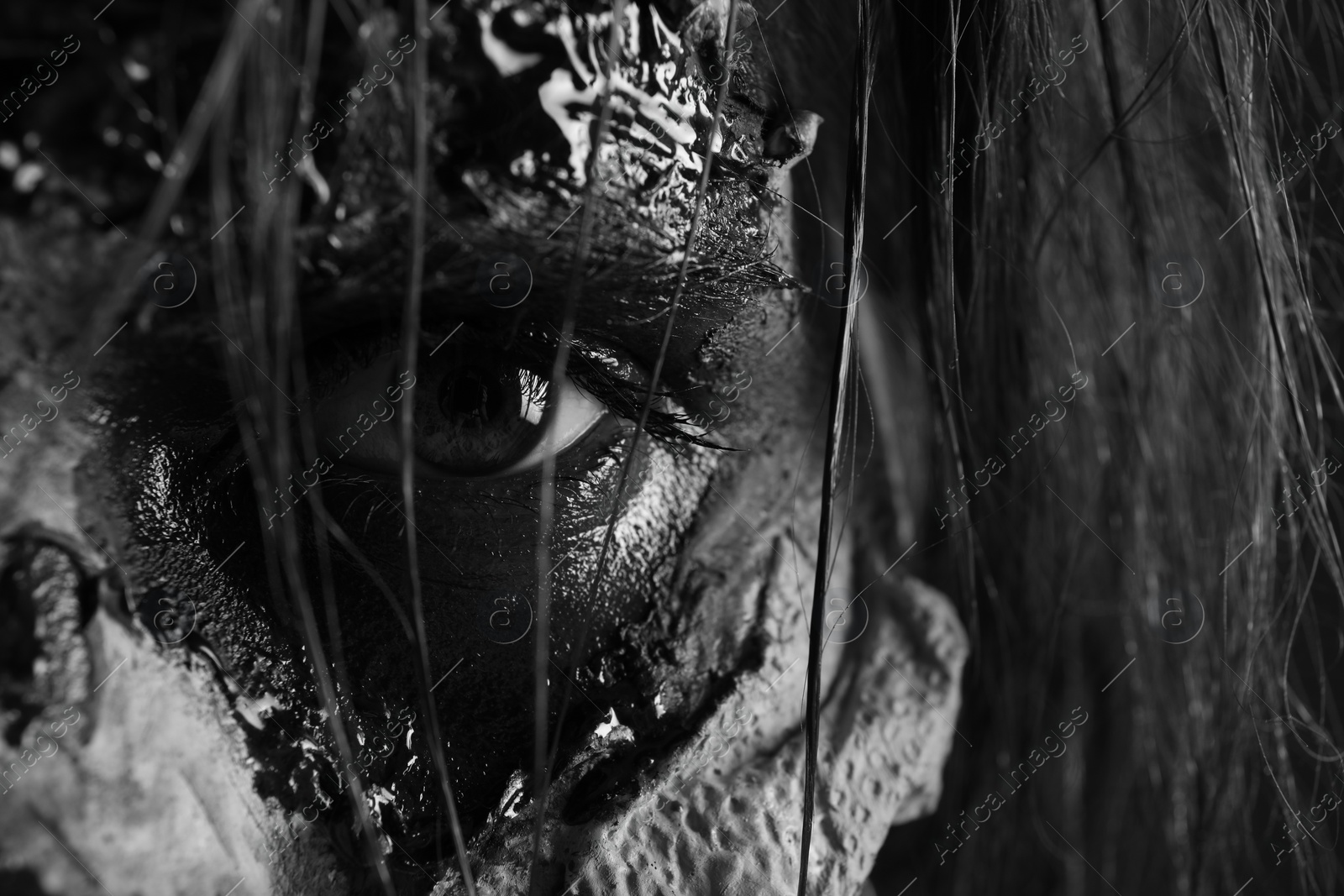 Photo of Closeup view of scary zombie, black and white effect. Halloween monster