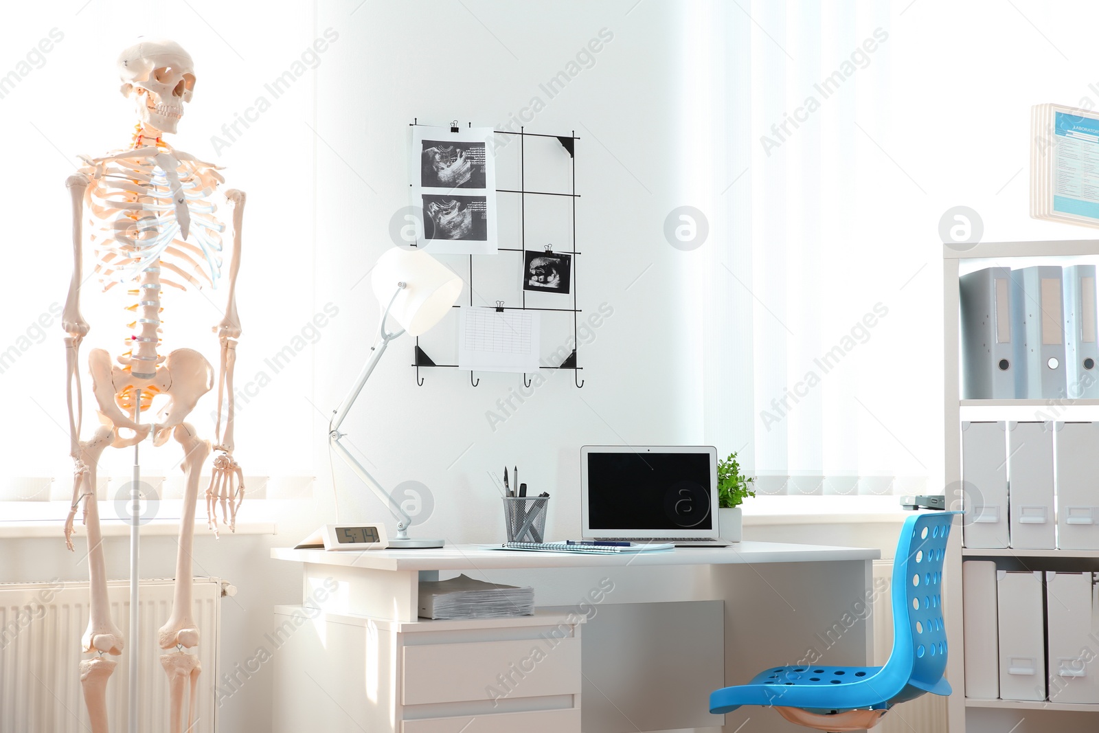 Photo of Interior of modern medical office. Doctor's workplace