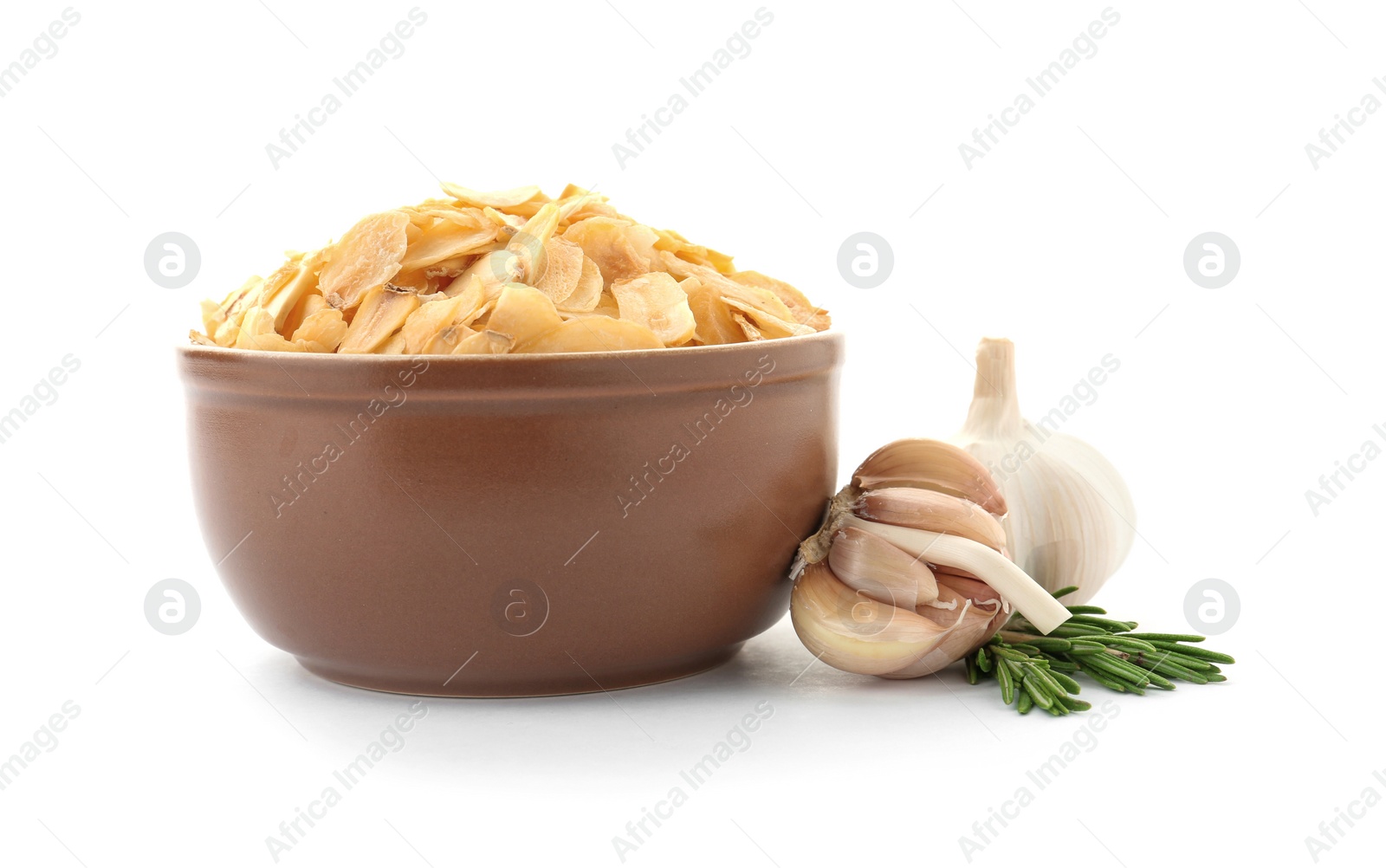 Photo of Bowl of dried garlic flakes and rosemary on white background