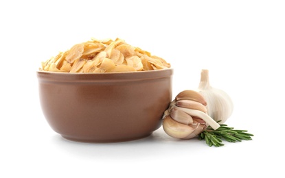 Bowl of dried garlic flakes and rosemary on white background