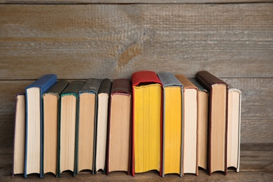 Photo of Stack of hardcover books on wooden table