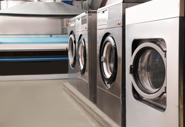 Laundry equipment in dry-cleaning. Space for text