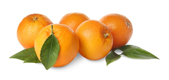 Photo of Fresh ripe oranges with green leaves on white background