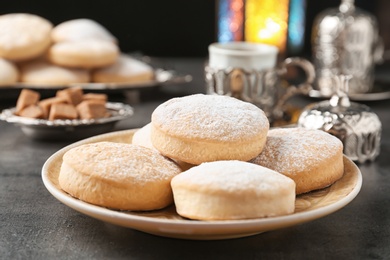 Composition with traditional cookies for Islamic holidays on table. Eid Mubarak