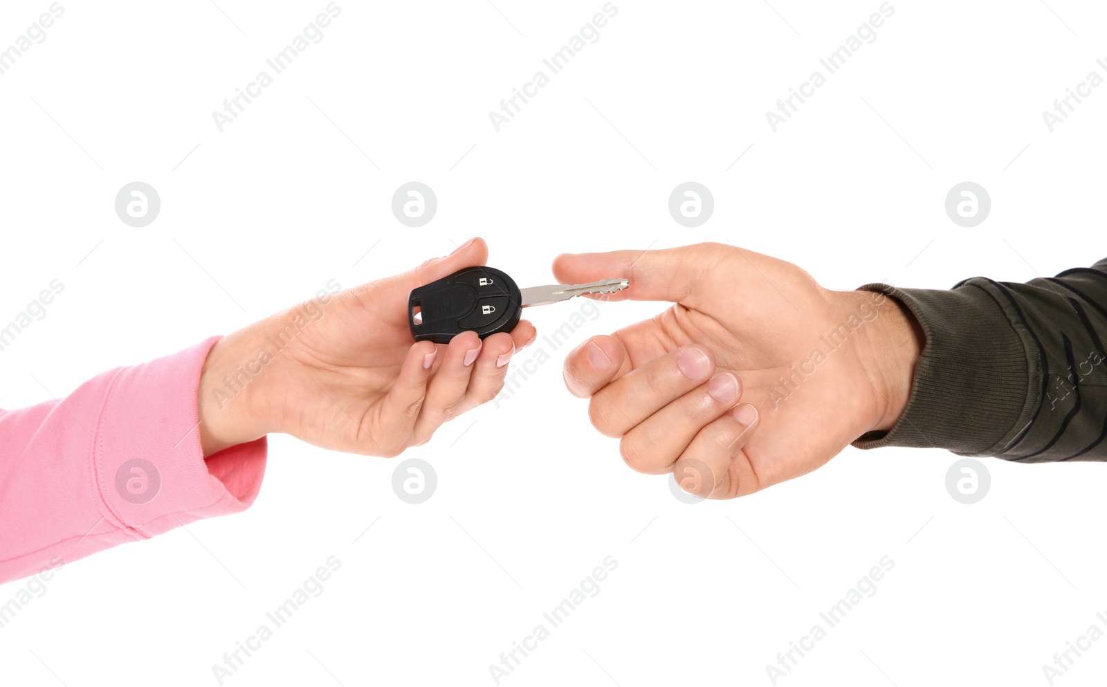 Photo of Agent giving car key to man on white background, closeup. Getting driving license