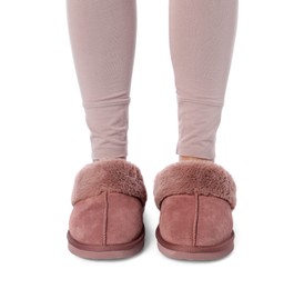 Photo of Woman in pink soft slippers on white background, closeup