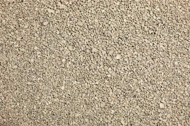 Photo of Clean clay cat litter as background, closeup