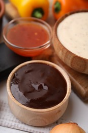 Photo of Fresh marinade in bowl on white wooden table, closeup