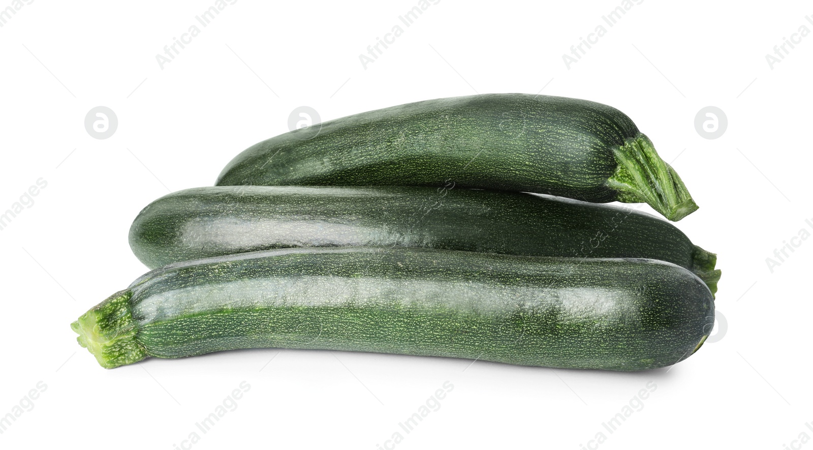 Photo of Raw green ripe zucchinis isolated on white