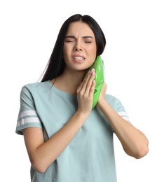 Woman using hot water bottle to relieve neck pain on white background