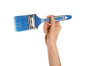 Photo of Woman holding paint brush on white background, closeup