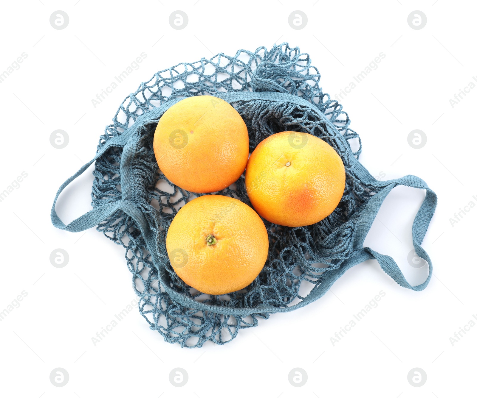 Photo of String bag with oranges isolated on white, top view