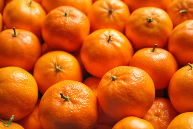 Photo of Delicious fresh ripe tangerines as background, closeup