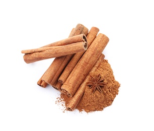 Aromatic cinnamon sticks and powder on white background