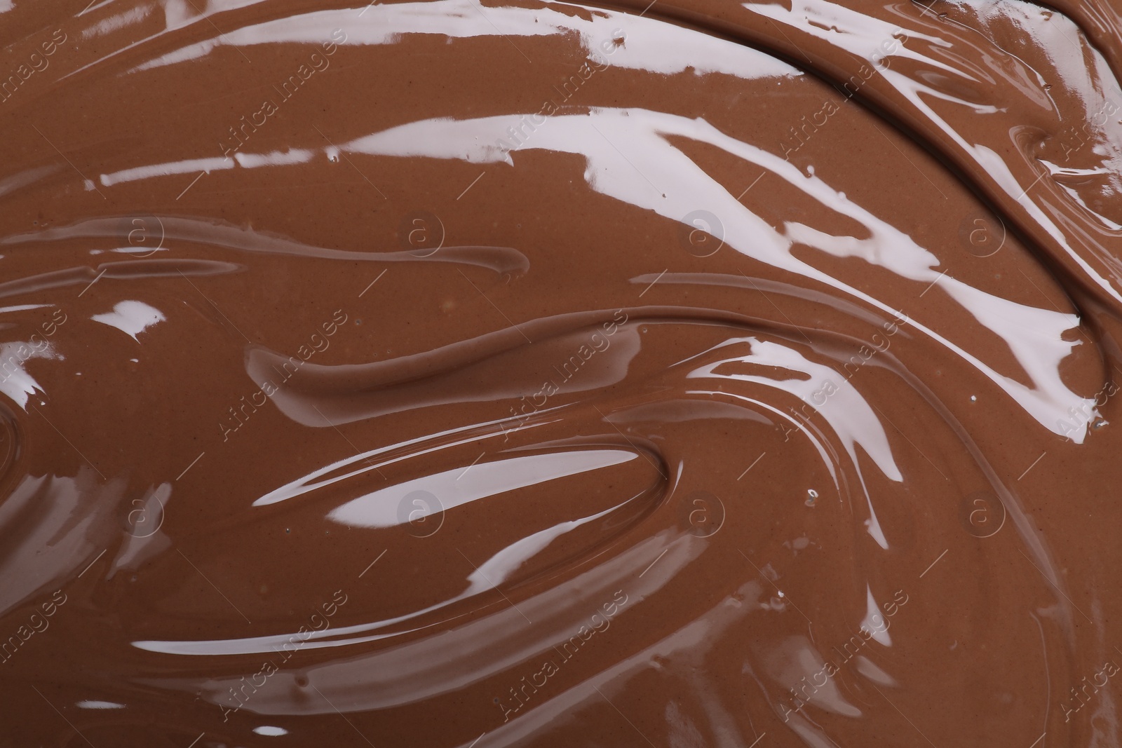 Photo of Tasty chocolate paste as background, closeup view