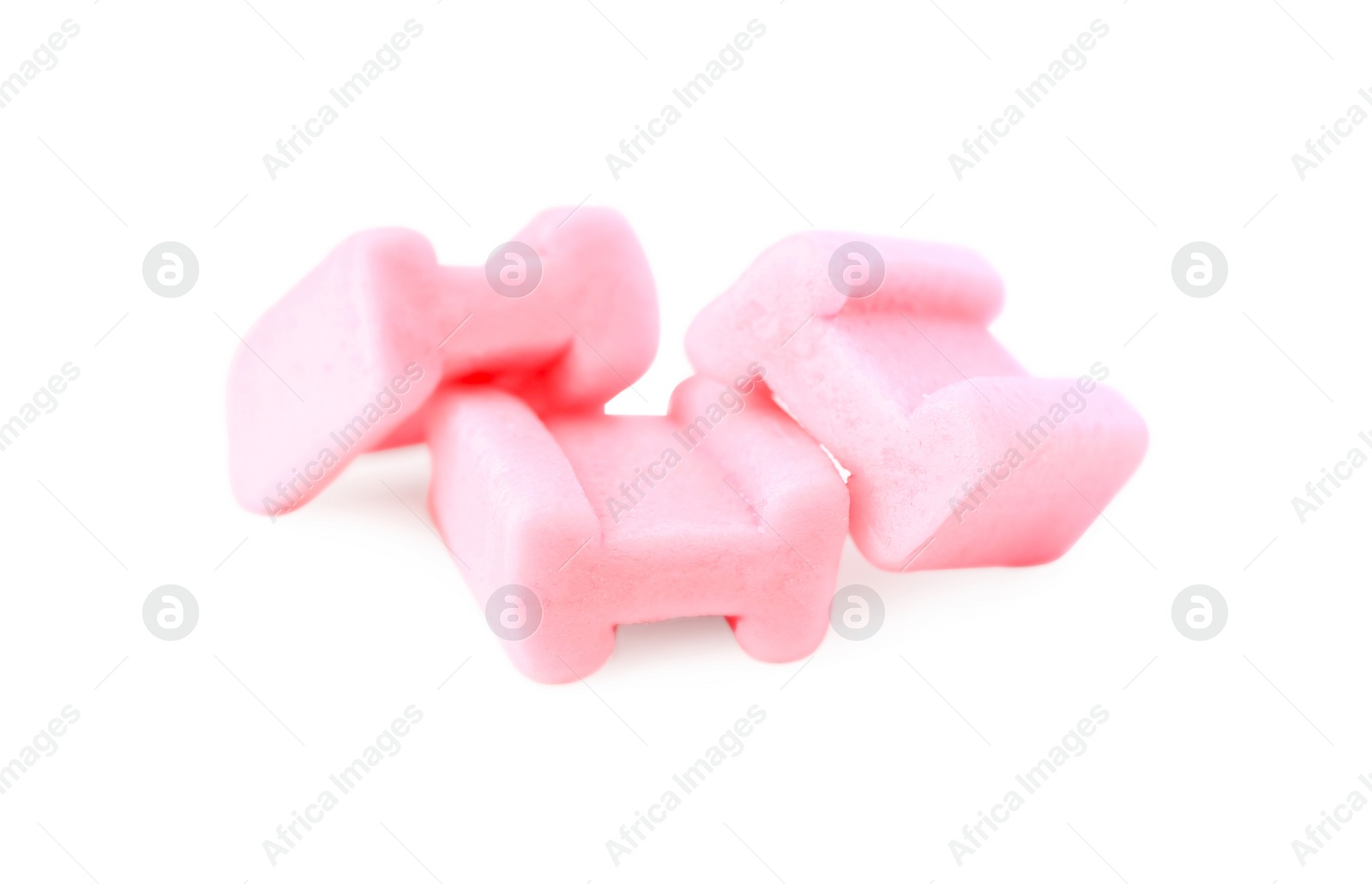 Photo of Tasty pink chewing gums isolated on white