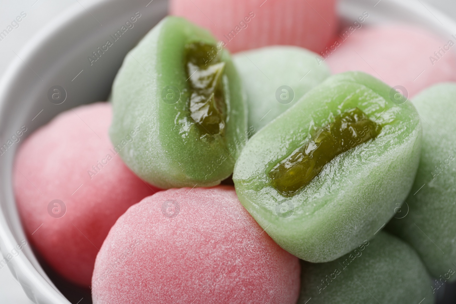 Photo of Delicious mochi in bowl, closeup. Traditional Japanese dessert