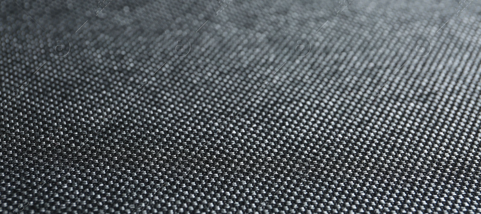 Photo of Texture of dark fabric as background, closeup