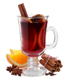 Photo of Aromatic mulled wine and ingredients on white background