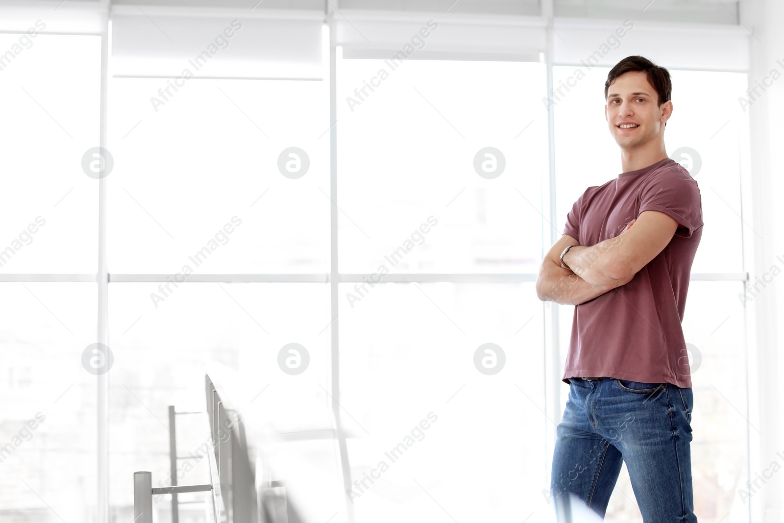 Photo of Portrait of confident young man, indoors