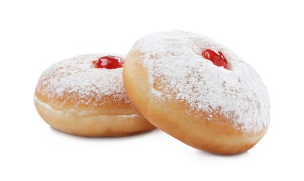 Delicious donuts with jelly and powdered sugar on white background