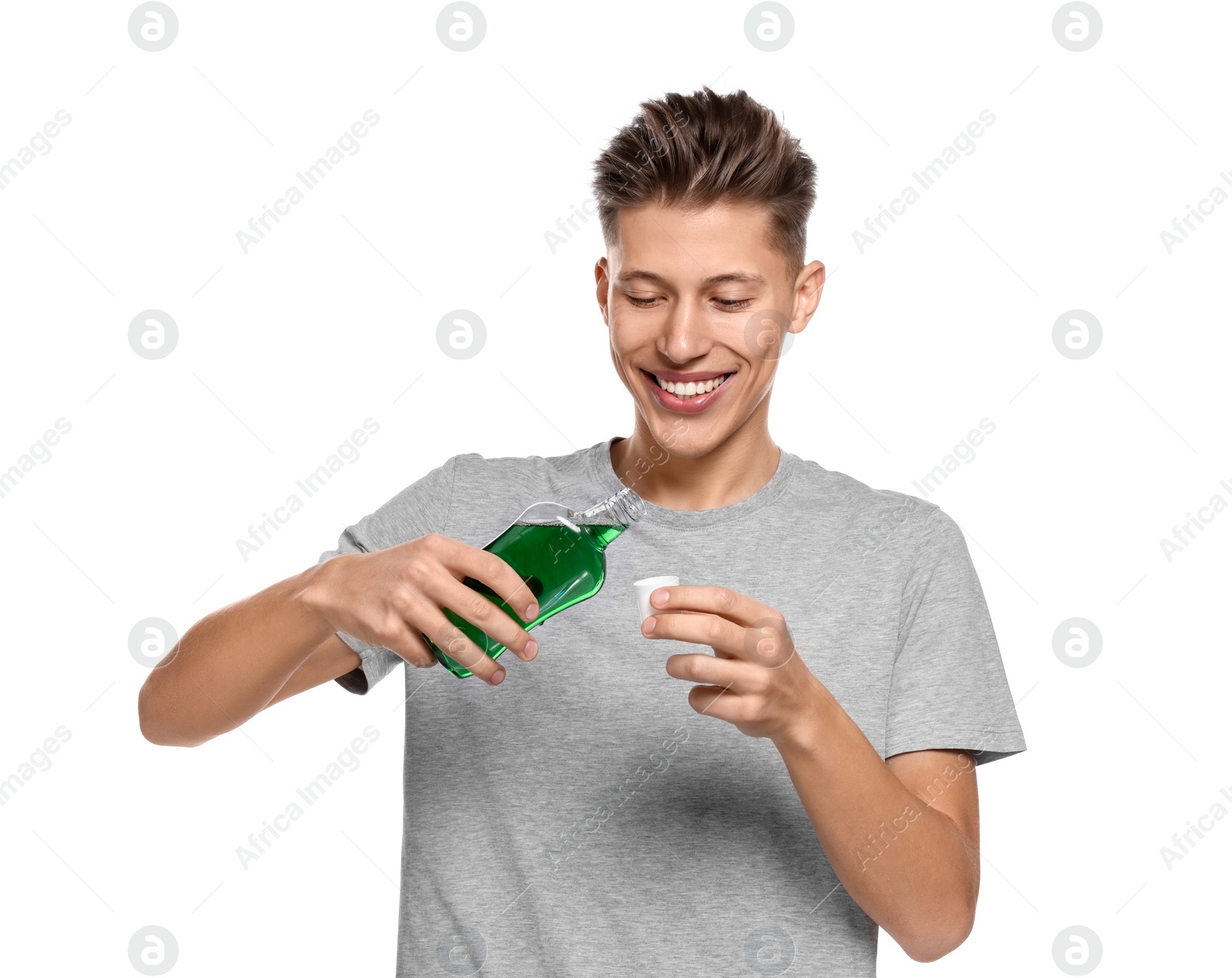 Photo of Young man with mouthwash on white background