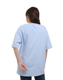 Photo of Woman in stylish light blue t-shirt on white background, back view