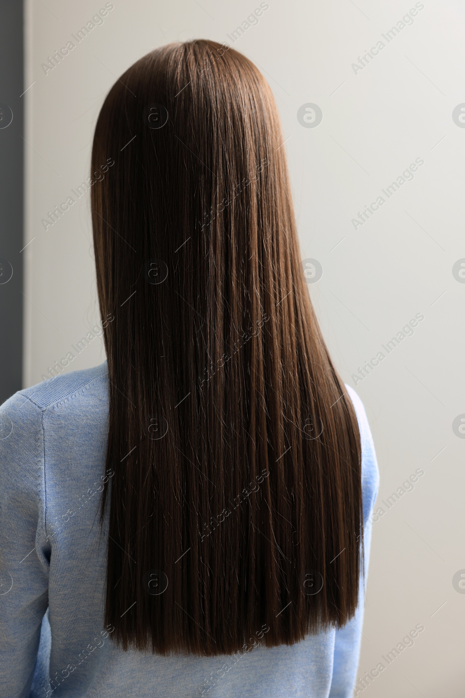 Photo of Woman with straight hair indoors, back view