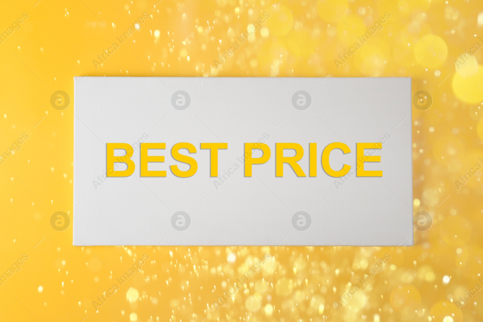 Image of Canvas with phrase Best Price on yellow background with blurred lights
