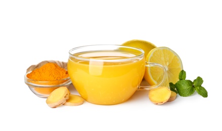 Photo of Immunity boosting drink with lemon, ginger, mint and turmeric on white background