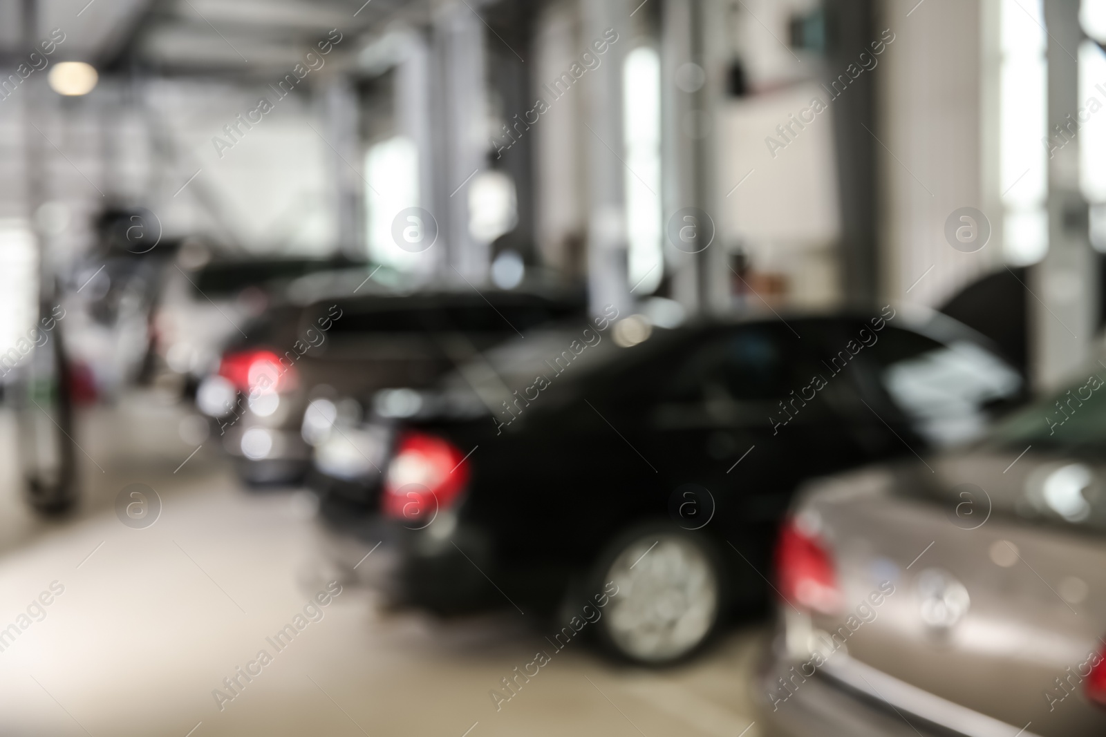 Photo of Blurred view of modern automobile repair shop