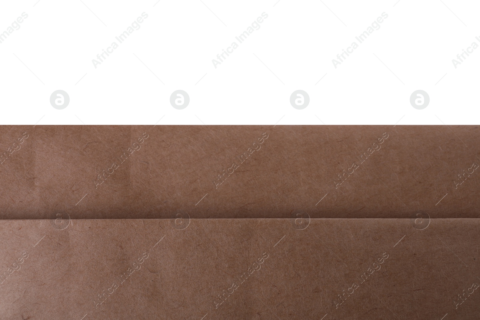 Photo of Kraft paper bag on white background, closeup