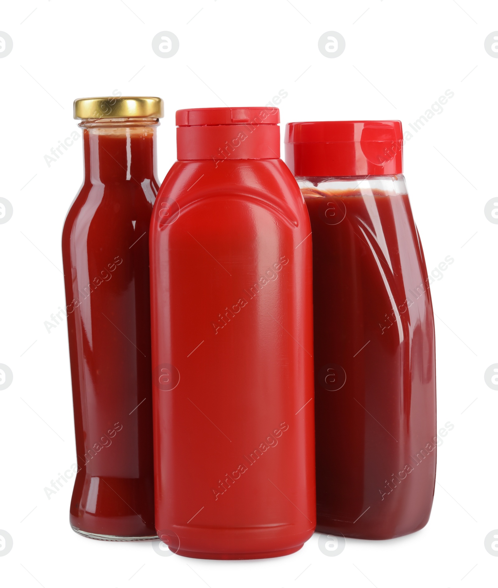 Photo of Different bottles of ketchup on white background