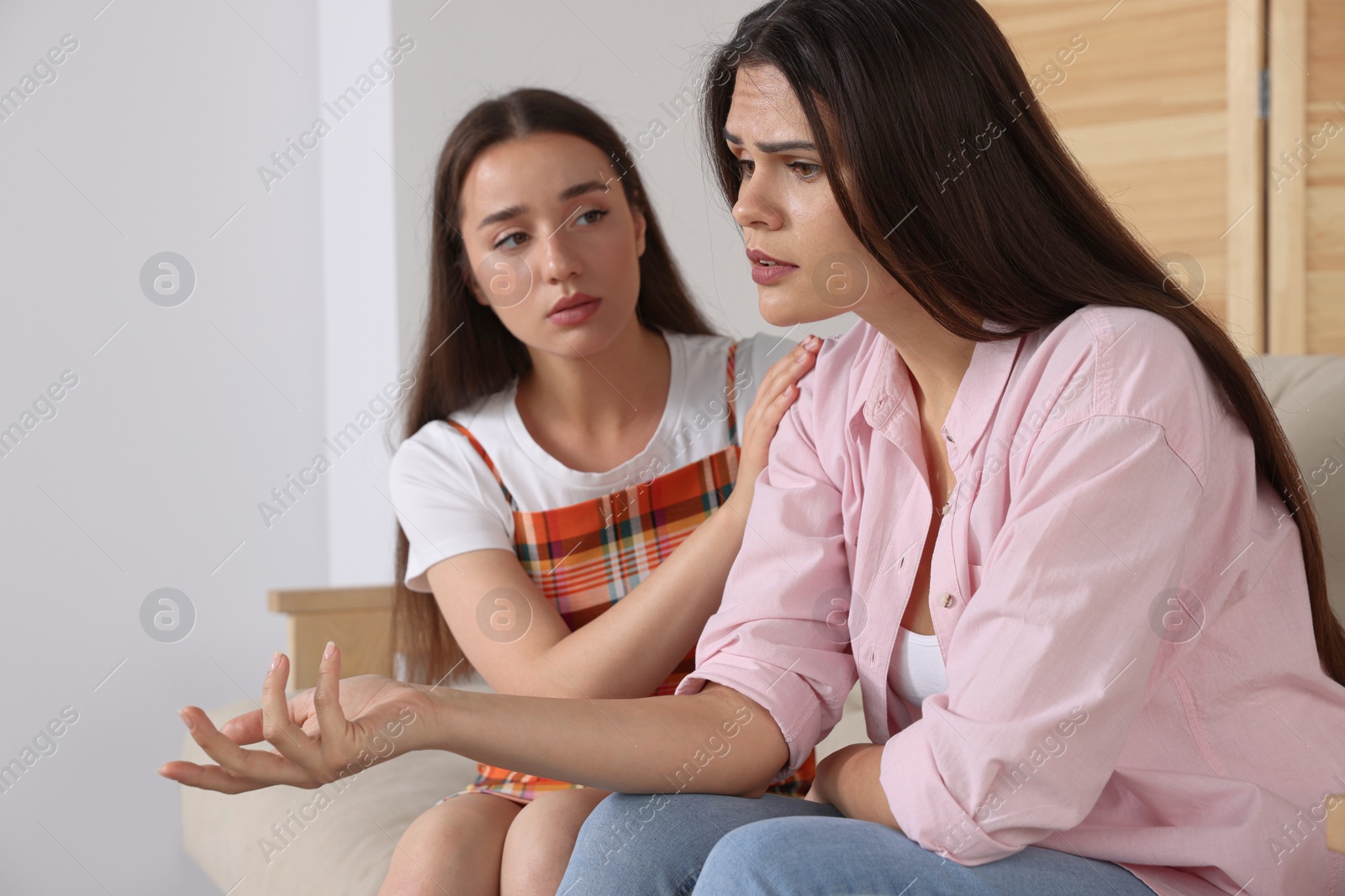 Photo of Professional psychologist working with young woman in office