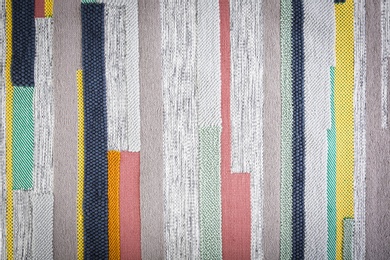 Photo of Colorful striped carpet as background