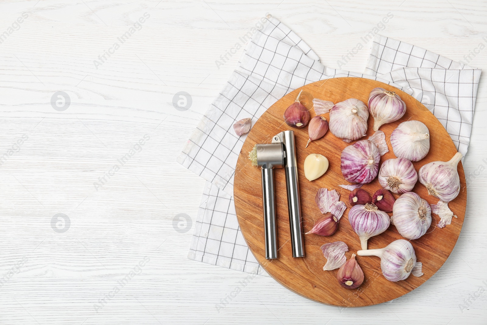 Photo of Flat lay composition with garlic press on wooden table