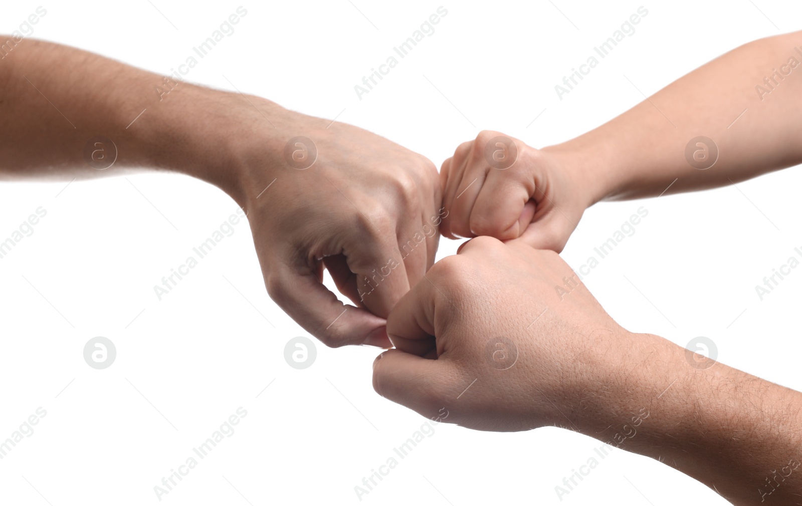 Photo of People holding fists together on white background, closeup