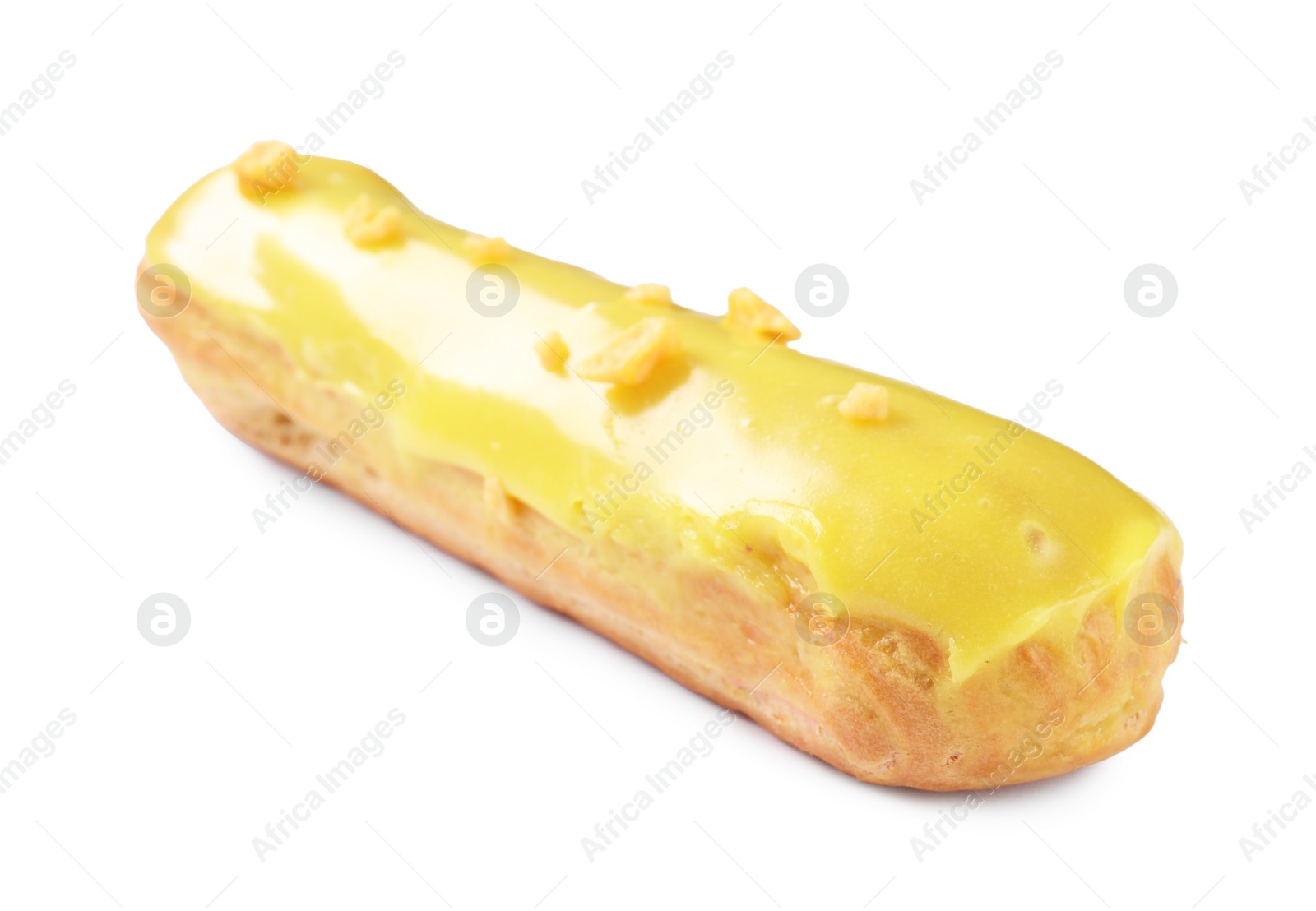 Photo of Delicious eclair covered with yellow glaze isolated on white