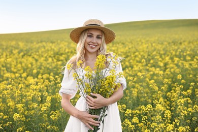 Photo of Portrait of happy young woman in field on spring day