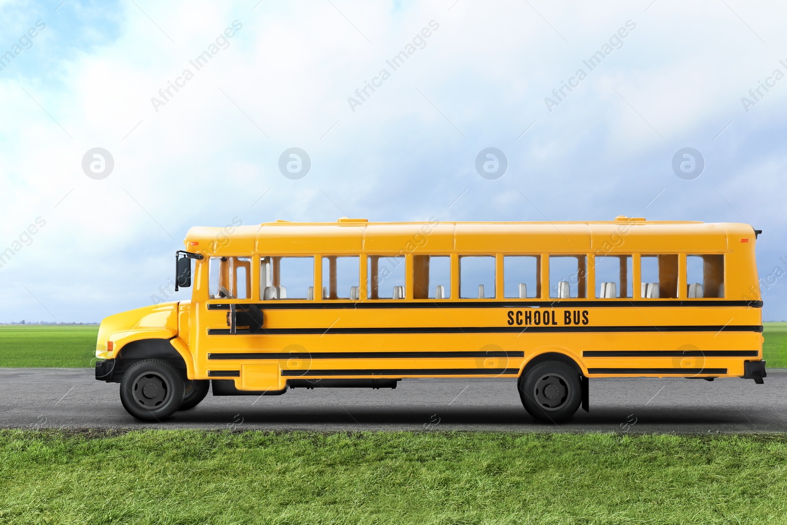 Image of Yellow school bus on road outdoors. Transport for students