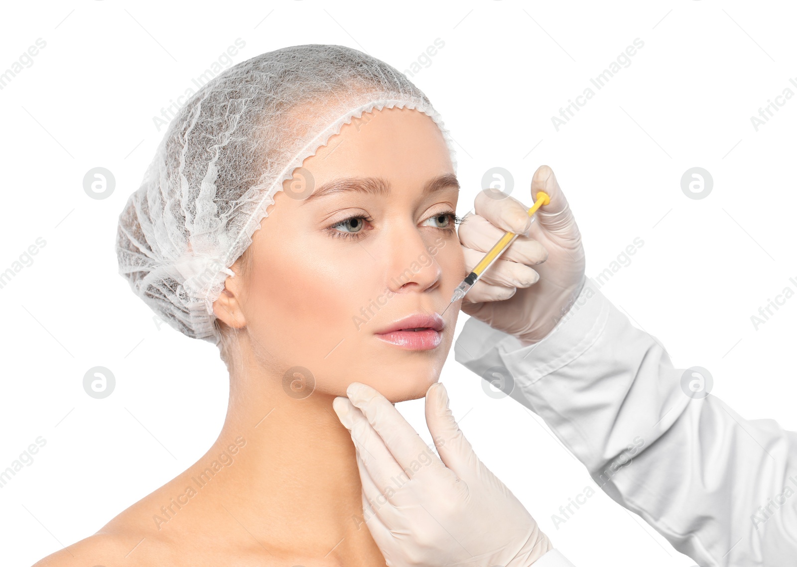 Photo of Young woman getting lips injection on white background. Cosmetic surgery