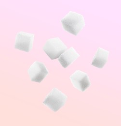 Image of Refined sugar cubes in air on color background